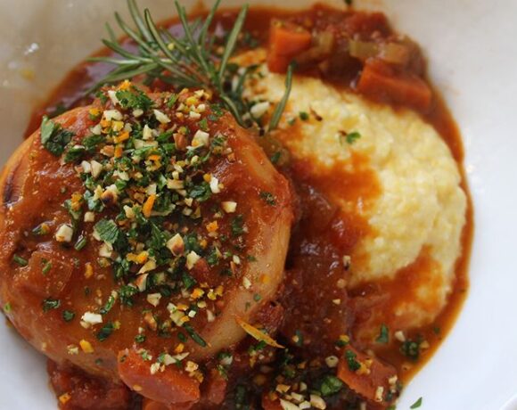 Creamy polenta topped with turnip osso bucco and pistachio gremolata