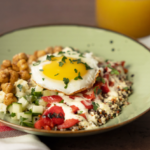 bowl with vegetables and quinoa with a fried egg on top